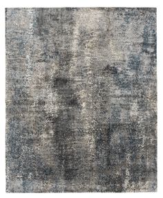 an area rug with grey and blue tones