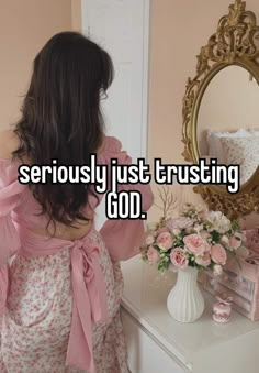 a woman standing in front of a mirror with the words seriously just trusting god