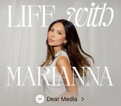 a woman standing in front of a white curtain with the words life south marina on it