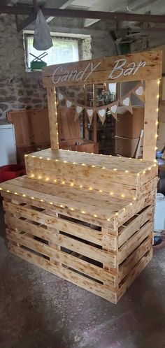 a large wooden box with lights on the top and bottom, sitting in a room