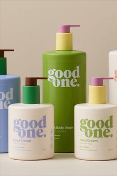 several different types of hand and body lotion bottles on a white surface with the words good one written on them