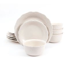 a white dinner set with five plates and four bowls