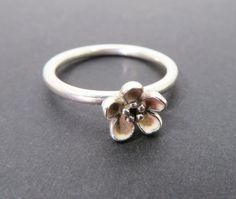 A pretty sterling silver ring with a single raised flower with light pink enamel. Marked S925 ALE 54 inside, which shows it is a Pandora ring. Striking on its own or as a stackable ring. Good condition. Measurements: UK size N / USA 6.5. Weighs 2.4. All postage is tracked to ensure safe arrival, free to UK buyers. I combine postage wherever possible. For more items of interest please visit https://www.etsy.com/shop/BlueGatto Pandora Flower Ring, Pandora Flower, Pewter Ring, Pandora Ring, Pandora Rings, Pink Enamel, Stackable Ring, Flower Ring, Stackable Rings