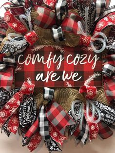 a red and black wreath with the words country cozy are we on it