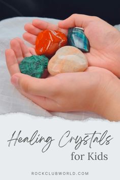 two hands holding rocks with the words, helping crystals for kids