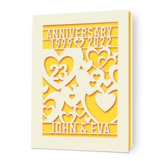 an anniversary card with hearts cut out from paper and the words john & eva on it