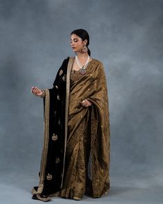 Introducing our Silk Velvet Chand Bali Dushala, a luxurious masterpiece of traditional craftsmanship. Adorned with intricate hand-embroidered Zardozi work, this exquisite shawl features a rich antique gold border, infusing opulence and elegance into any ensemble. Visit us at B-25, Defence Colony, New Delhi. We look forward to your presence. www.richaahluwalia.com/collection/chandbali-black-doshala-wedding-saree/ To schedule an appointment or arrange a video call, please dial +91 8800880840.... Saree With Velvet Shawl, Saree With Shawl, Suit With Shawl, Tangled Wedding, Rich Outfits, Shawl Outfit, Saree Styling, Chand Bali