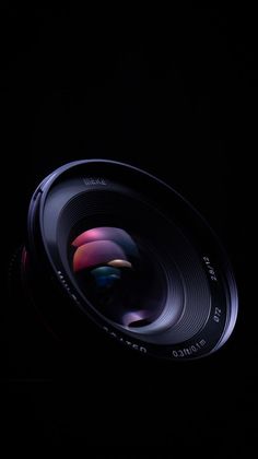 a camera lens is shown in the dark