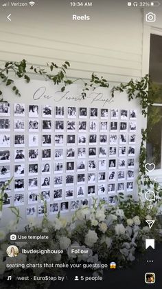 the wall is decorated with flowers and photos for wedding guests to take pictures on it