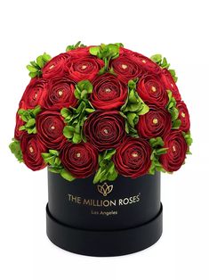 the million roses bouquet in a black round box with green leaves and red flowers on top