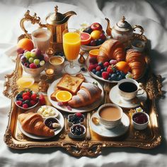 a tray filled with breakfast foods on top of a bed