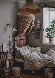 a bed sitting under a window in a bedroom