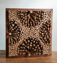 a wooden block with many pieces of wood cut in half and arranged into an intricate pattern