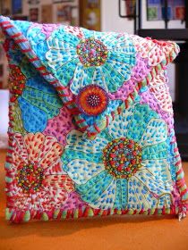 a colorful purse sitting on top of a wooden table