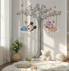 a child's room with mickey and minnie mouse wall decals