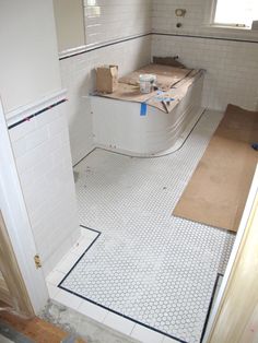 the bathroom is being remodeled and ready to be used as a bathtub in the process of remodeling