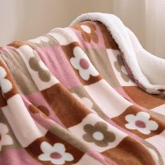 a blanket that has flowers on it