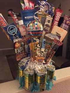 a gift basket filled with soda cans and snacks