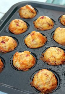 some muffins are in a black pan on a table