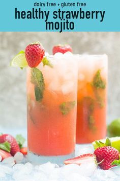 two glasses filled with fruit and ice on top of a bed of snow next to strawberries