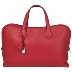 Hermes 'Victoria II Porte-Documents' business bag in Rouge Garance (true red) Taurillon Clemence leather. Closes with a two-way zipper. Lined in canvas with three open pockets against the front and a laptop pocket against the back. Has been carried with slight wear to the bottom corners. Overall in excellent condition. Comes with keys, lock, clochette and dust bag. Height 28.5cm (11.1in) Width 40cm (15.6in) Depth 9cm (3.5in) Drop of the Handle 14cm (5.5in) Blindstamp T MM 001 Hermes Crossbody Bag, Briefcase Bag, Togo Leather, Kelly Bag, Jane Birkin, Business Bag, True Red, Hermes Bags, Grace Kelly