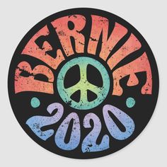 a sticker with the words peace and a peace sign in rainbow colors on it