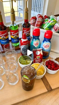 an assortment of condiments and drinks on a table