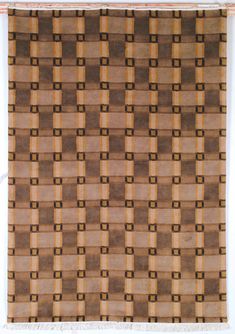 a brown and tan rug with squares on it