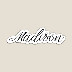 the word madison is shown in black ink on a light gray background with white lettering