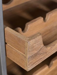 a close up of a wooden drawer with metal handles