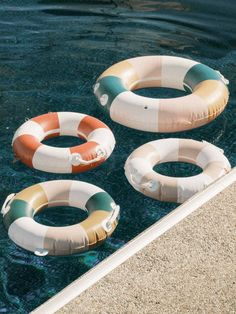 three inflatable floats floating on the water