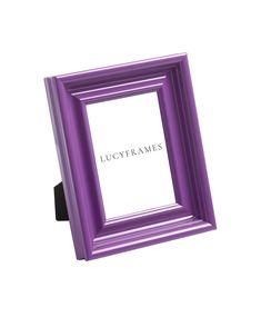 a purple frame sitting on top of a white wall next to a black object with the word lucgyframes written in it