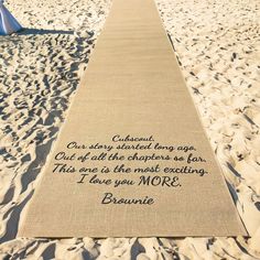 a long path on the beach with a poem written on it