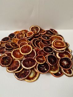 a pile of sliced oranges sitting on top of a table