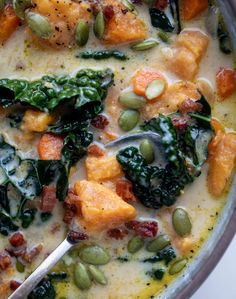 a close up of a bowl of food with broccoli and other foods in it