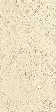 an image of a white wallpaper with intricate designs on it's surface, as well as the background