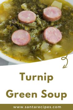 a white bowl filled with green soup and sausage