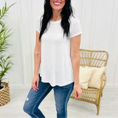 Made With Extra Soft, Flowy, And Stretchy Material, This Crewneck Top Is Perfect For Layering Or Wearing On Its Own All Year Long. Its Versatile Design Allows You To Dress It Up Or Down. Don't Miss Out On This Wardrobe Essential! Style This Top With Shorts And Sandals For An Easy Everyday Look, Or Change It Up And Wear It Under A Shacket With Jeans And Sneakers! Materials: 95% Rayon 5% Spandex White Shirttail Hem Top For Spring, White Short Sleeve Top For Layering, White Relaxed Fit Top With Shirttail Hem, White Tops With Relaxed Fit And Shirttail Hem, White Relaxed Fit Tops With Shirttail Hem, White Shirttail Hem Top For Day Out, White Short Sleeve Top, Relaxed Fit For Day Out, White Relaxed Fit Short Sleeve Top For Day Out, Basic White Tops For Day Out