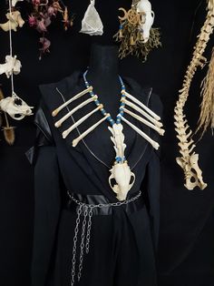 Have a Look at This Extra Large Raccoon Skull And Coyote Bone Necklace! There are 8 Real Coyote Radius Bones and 3 Real Coyote Vertebrae On This Necklace! The Raccoon Skull is in Near Perfect Condition. It is Strung on Blue leather and Beaded With Blue and Gold Beads. This Necklace is Adjustable From 26 - 30 Inches. All Items Ship Within 1-3 Days via USPS Ground Advantage Service. Shipping on these will be 5.50 (USA Only) All additional items are FREE! I Am Only Offering International Shipping To Canada Right Now, I Apologize as Customs Overseas is Growing Evermore Difficult With Bones and Skulls. Canada 25.00 + 2.00 For Each Additional Item. I DO NOT Carry Human Bones or Any Sort of Illegal Items. And As Etsy Sellers, We Are Not Allowed to Sell Domesticated Dog or Cat Bones of Any Sort. A Radius Bone, Cat Bones, Real Bone Jewelry, Raccoon Skull, Wiccan Necklace, Antler Necklace, Human Bones, Real Bones, Halloween Necklace