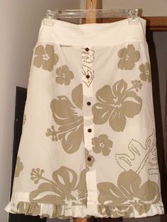 a white skirt with brown flowers on it