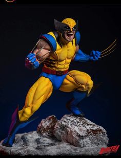 the wolverine action figure is posed on top of a rocky cliff with his claws out