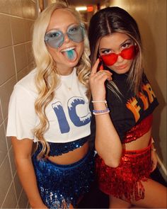 two young women in costumes posing for the camera