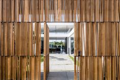 an entrance to a building with wooden slats