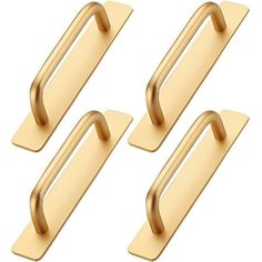 three gold metal door handles on a white background