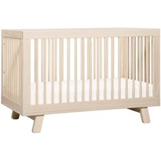 a white baby crib with no mattress in the bottom half and two legs on each side