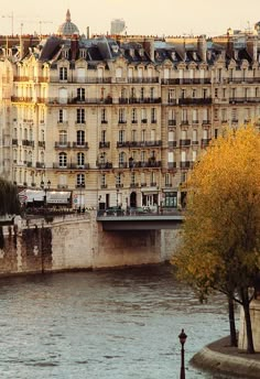 a river running through a city next to tall buildings