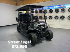 a black golf cart with the words street legal $ 13, 999