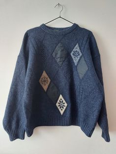 Vintage Retro Sweater, 80s Knitwear, Unisex Jumper,  80s Pullover, Vintage Grey Knitted Sweater, Grandpa Sweater, Archive Clothes with patch There is no composition tag, but I think it's wool MELKA Color navy blue Size L but see measurements  All measurements taken with garment laid flat: Chest 67cm / 26,37 in Lenght 63cm / 24,80 in Shoulders 67cm / 26,37 in Sleeve lenght 51cm / 17,71 in Condition used good Retro Knitted Sweater For Cold Weather, Retro Knitted Sweater For Winter, Oversized Vintage Wool Sweater, Vintage Winter Patchwork Tops, Oversized Vintage Cable Knit Sweater, Oversized Blue Vintage Sweater, Vintage Knit Sweater For Winter, Vintage Winter Knit Sweater, 90s Style Oversized Winter Sweater