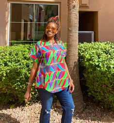 "Unique African print top made from African fabric 100% cotton. This colorful Ankara summer blouse is versatile, flattering, and available for all sizes including plus sizes. Features: Ankara blouse with split neckline. African shirt for women with side slits and fun curved hem. Wear this African top over pants, skirts, shorts, or jeans!  This item will be specially handcrafted for you upon purchase. We appreciate including your bust, waist, and hip measurements at checkout otherwise, we will us Summer Multicolor Tops With Bold Print, Summer Cotton Tunic With Short Sleeves, Cotton Tunic With Short Sleeves For Vacation, Casual Multicolor Tunic Blouse, Multicolor Short Sleeve Tops For Day Out, Vibrant Multicolor Print Shirt For Summer, Summer Cotton Printed Blouse, Printed Multicolor Cotton Blouse, Summer Cotton Blouse With Print