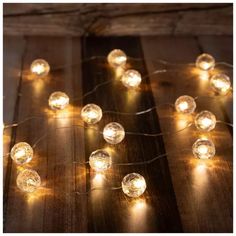 some lights that are on top of a wooden table